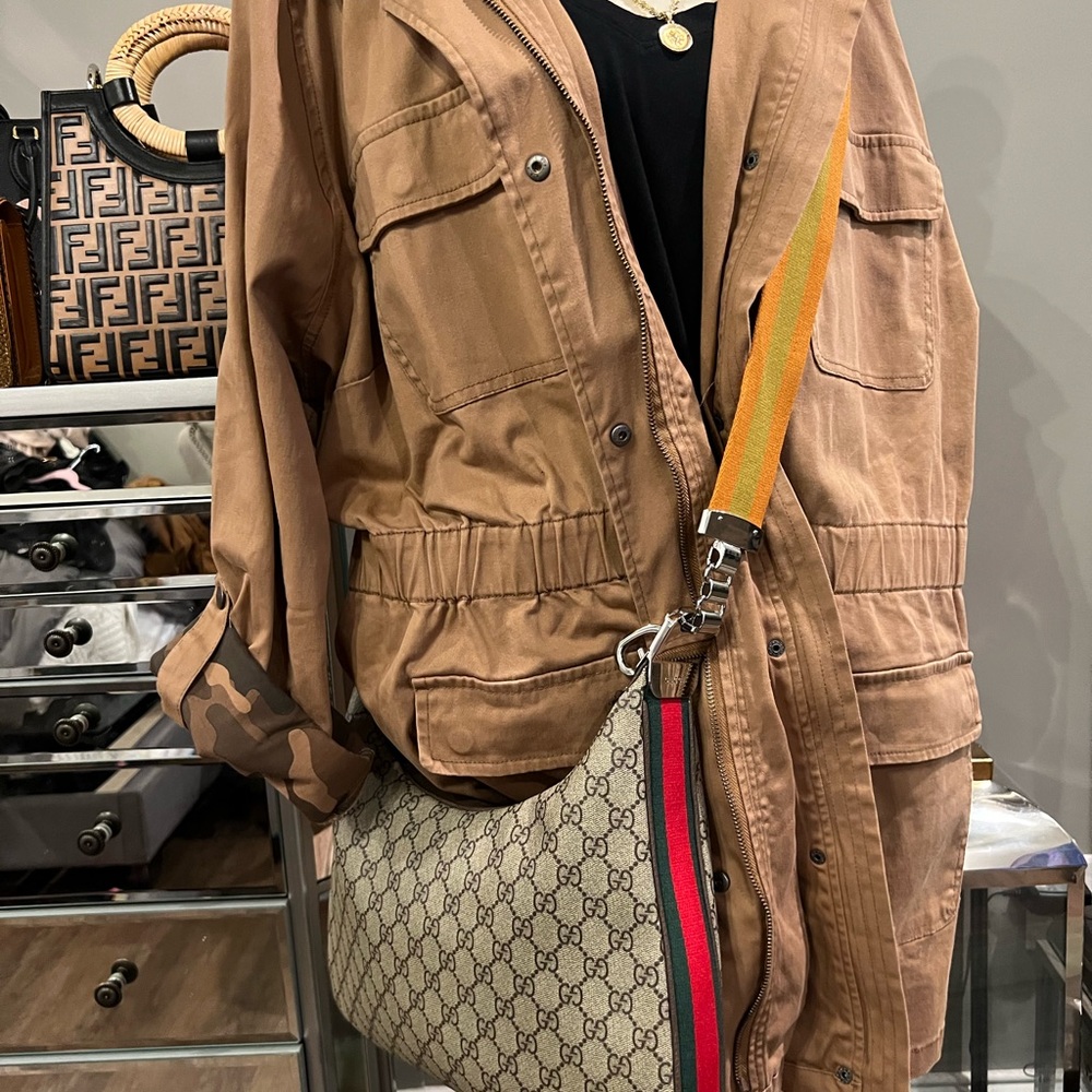This jacket is made like a shacket the inside has camouflage design sleeves roll - Picture 2 of 16